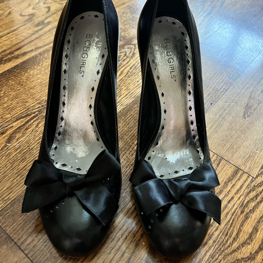 Bcbgirls Black Leather Round toe heels with satin bow, size 7.5